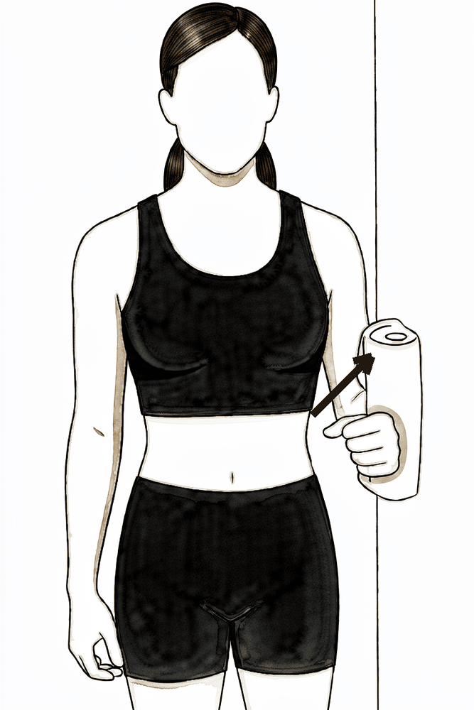 Standing with the elbow at the side, pressing the outside of the arm into a wall without moving it.