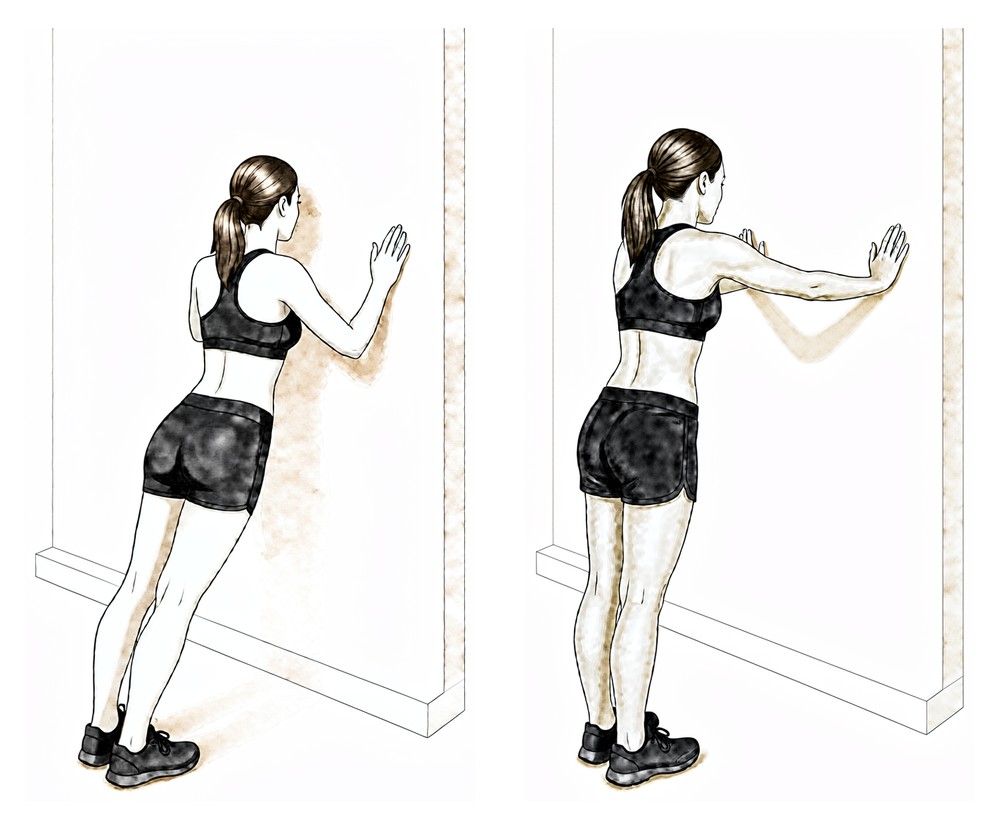 Standing with both hands on a wall, pushing the upper back away by rounding the shoulder blades forward.